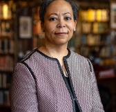 Image of Elain Westbrooks, smiling, in a library